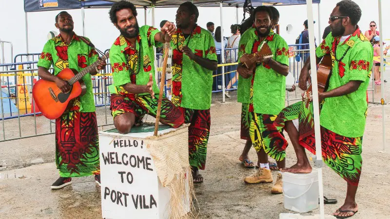 Local musicians in Vanuatu welcoming tourists with a cultural performance in Port Vila.