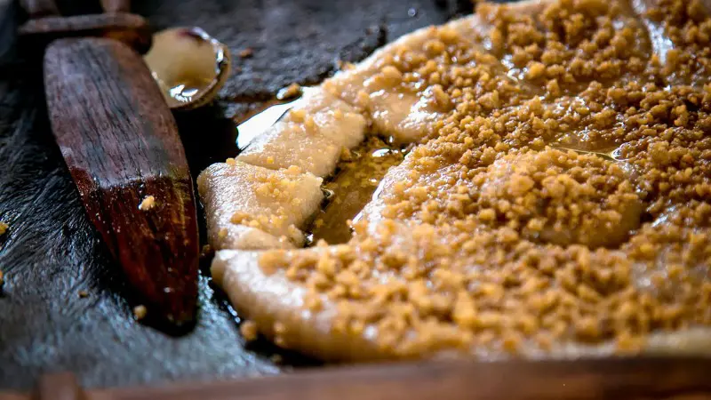 A traditional Vanuatu dish, lap-lap, made from coconut, yam, and cooked in banana leaves.