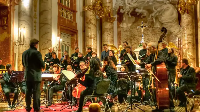 Choir and orchestra performing at Vienna's St. Charles Church.