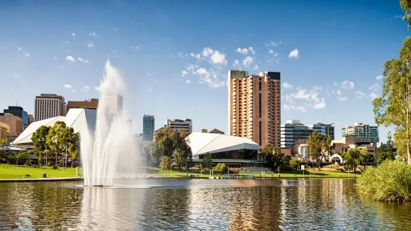 The picturesque Adelaide city skyline reflected in the River Torrens, showcasing the city's free natural beauty.