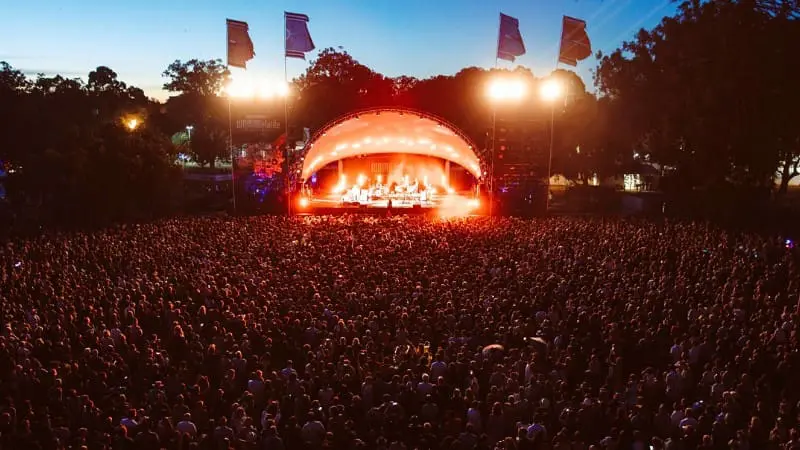 Massive crowd enjoying a free concert at night of WOMADelaide, one of the many free things to do in the city.