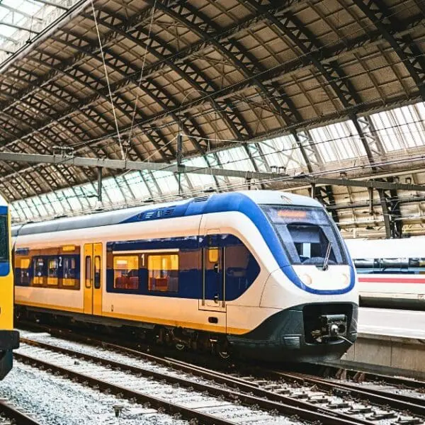 Trains at Amsterdam Centraal Station, showcasing places to visit near Amsterdam by train.