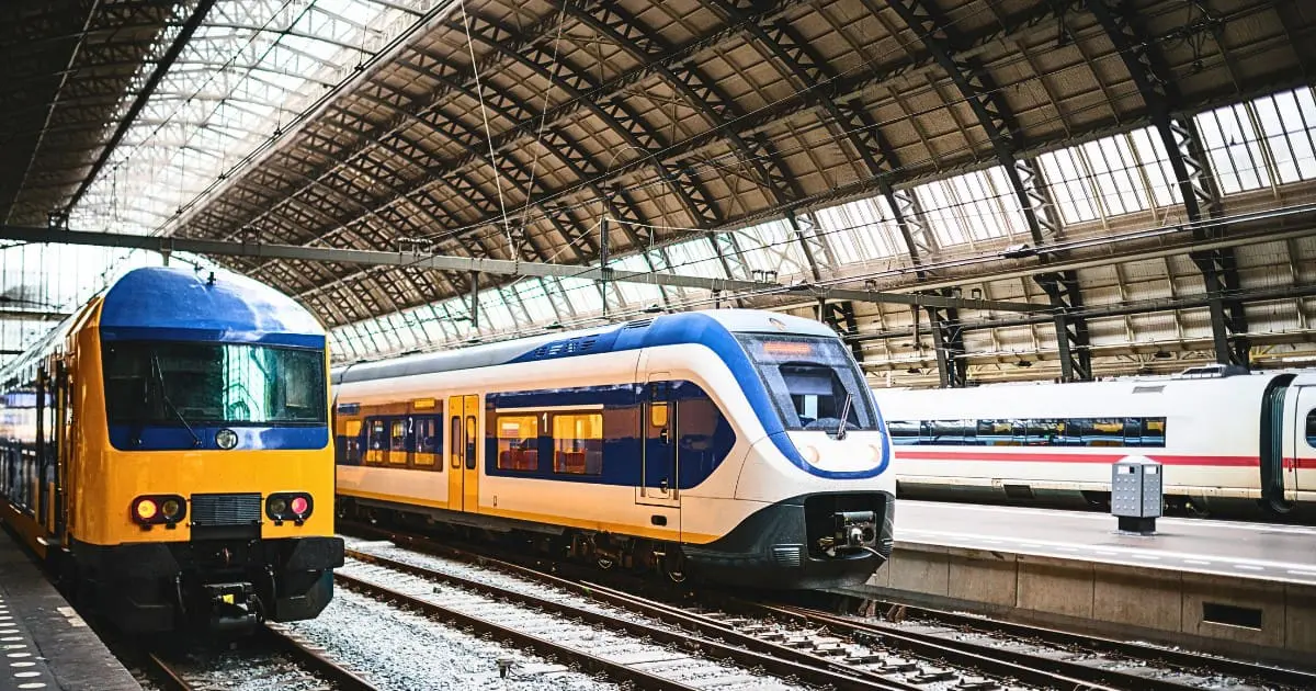 Trains at Amsterdam Centraal Station, showcasing places to visit near Amsterdam by train.