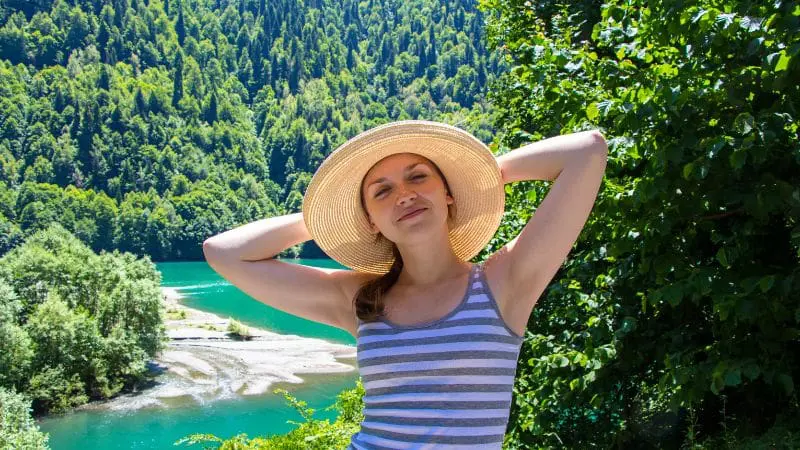 Woman enjoying the lush greenery of Panama, ideal during the wet season for nature lovers.