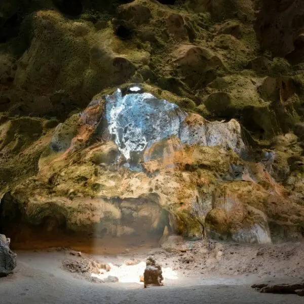 Majestic cave with sunlight streaming through in Arikok National Park.
