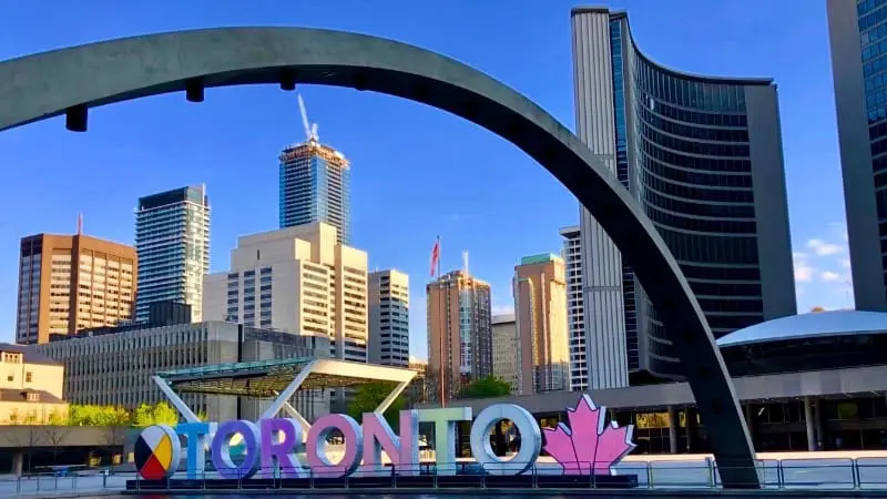 Toronto's iconic skyline welcomes newcomers to Canada's largest city.