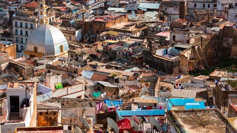 Aerial view of densely packed houses in Casbah Algiers, highlighting traditional urban structure.