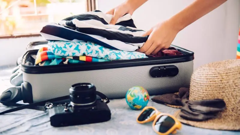 Essentials for a trip to El Calafate, Argentina, include warm clothes and a camera.