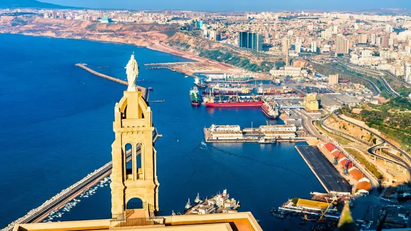 Oran's coastal skyline features the iconic Santa Cruz Chapel overlooking the city.