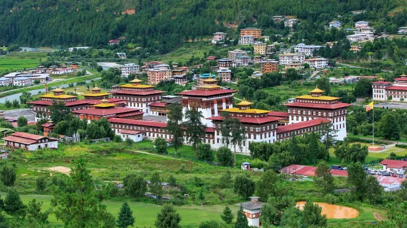 Aerial view of Thimphu Bhutan showcasing a mix of traditional and modern buildings.
