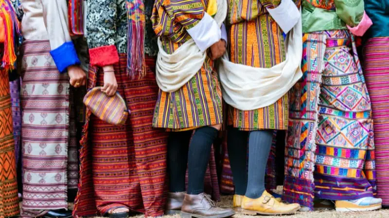 People in traditional Bhutanese attire gather during a cultural event in Thimphu.