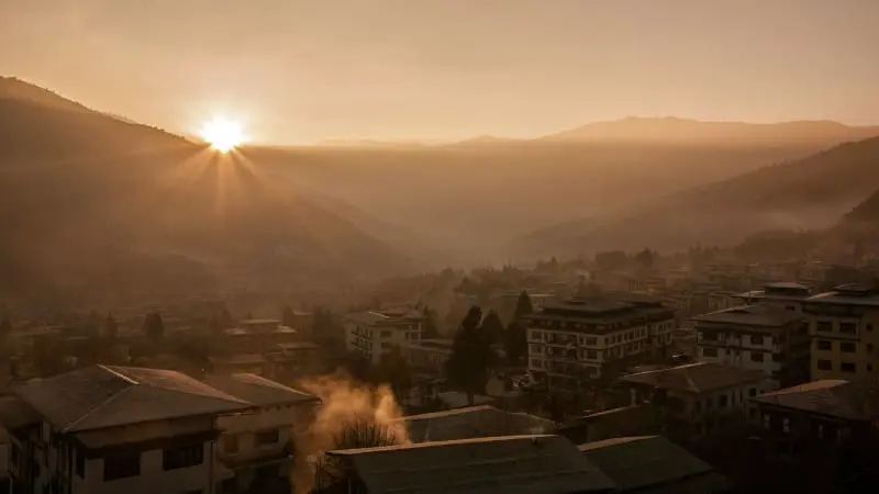 A stunning sunrise over the hills and valleys of Thimphu in Bhutan.