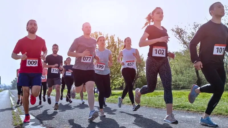 Runners participating in a scenic marathon event through Banff National Park.