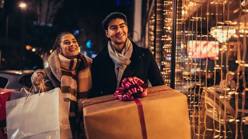 Couple enjoying late-night shopping during the Shopping Under the Stars event in Berlin, Ohio.