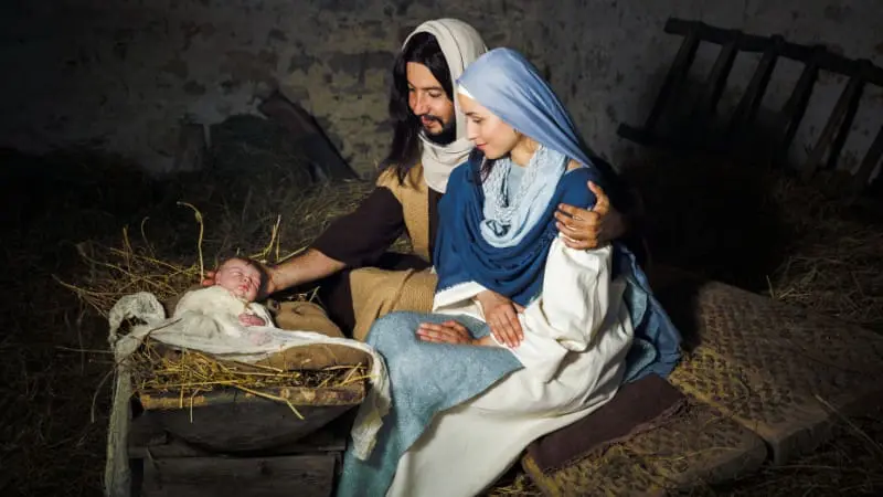 Live Nativity scene in Berlin, Ohio with actors portraying Mary, Joseph, and baby Jesus.
