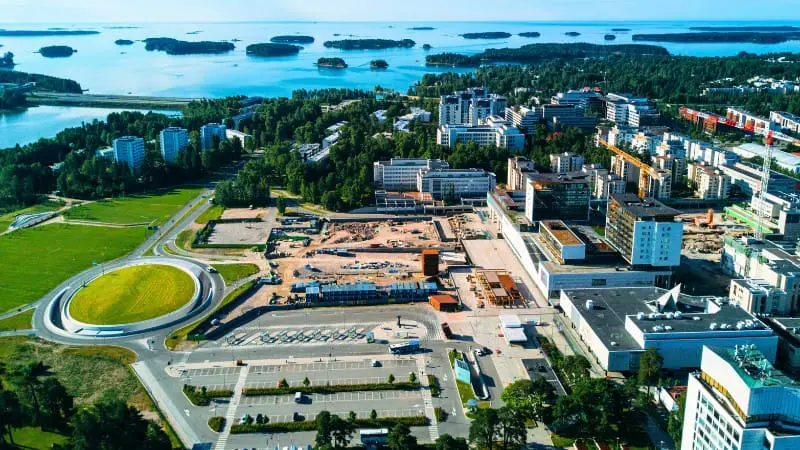 A modern city with many buildings and the sea in the background in Espoo.