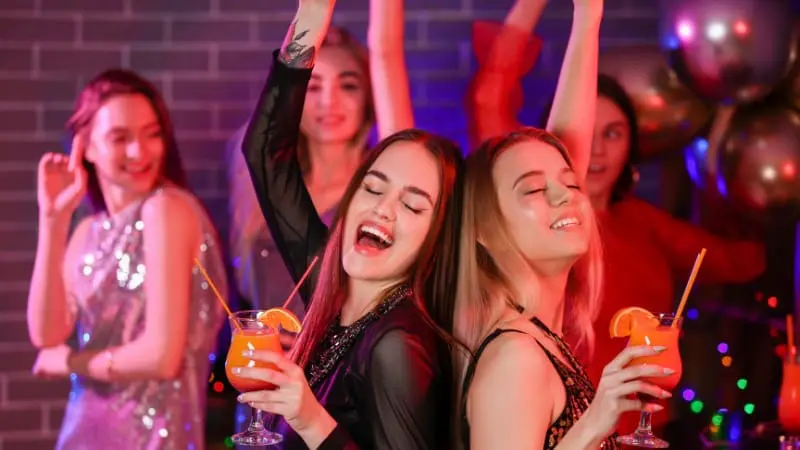 Couples dancing at a lively Nashville nightlife party.
