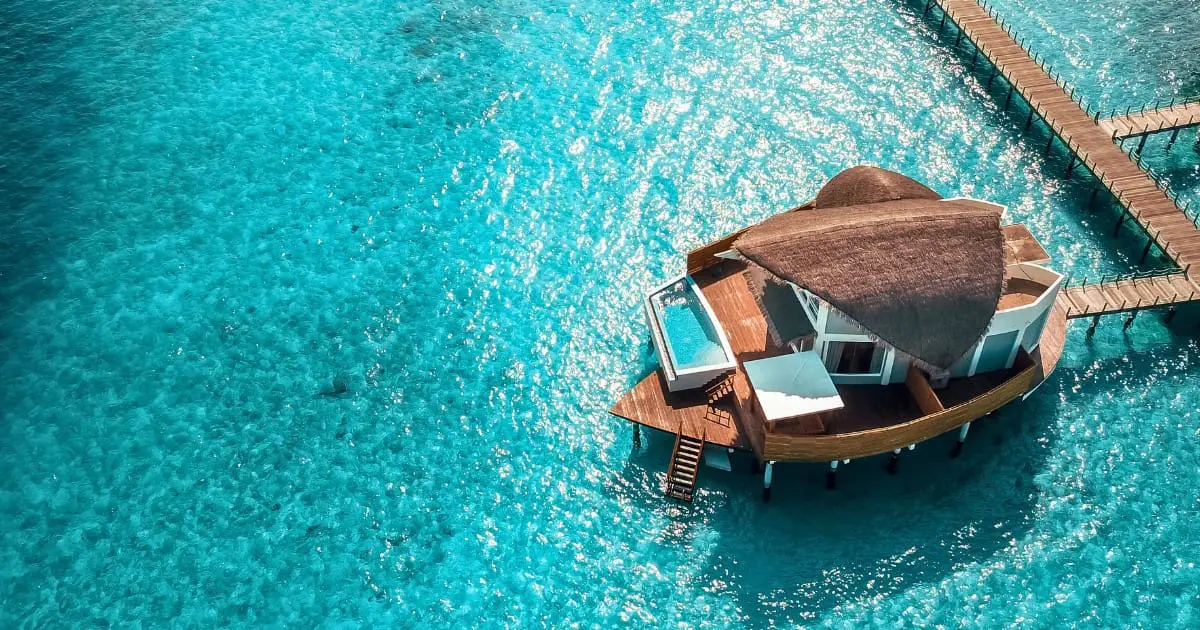 Overwater villa on a Maldives island for travelers seeking a perfect getaway.