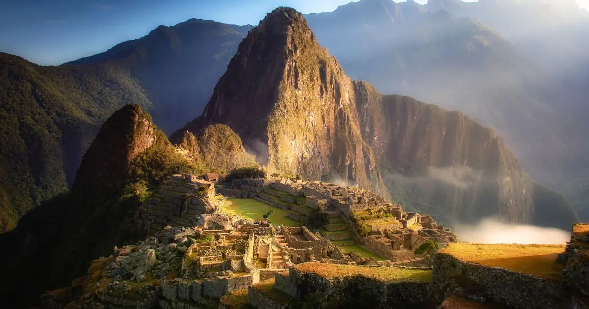 Machu Picchu surrounded by the misty cloud forest in the Andes.