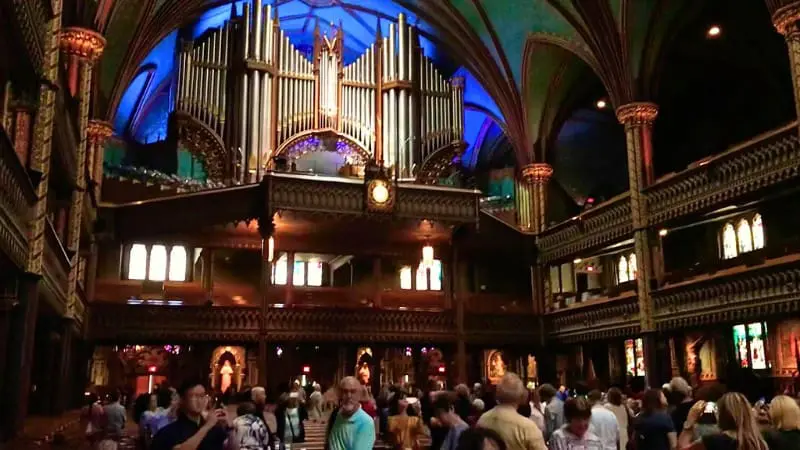 Visitors admire the grand organ inside Notre Dame Basilica of Montreal