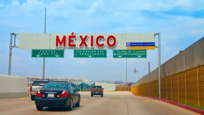 Cars driving into Mexico, showing a safe entry point for travelers.