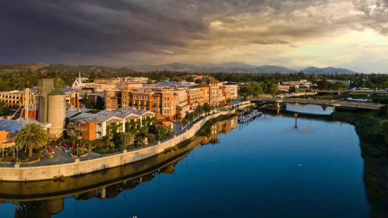 Beautiful riverside view of Downtown Napa's buildings and attractions.