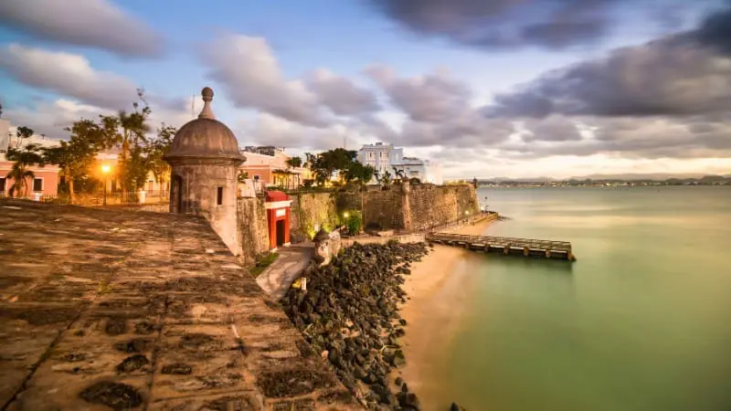 Historic fort by the ocean in San Juan with a sunset view.