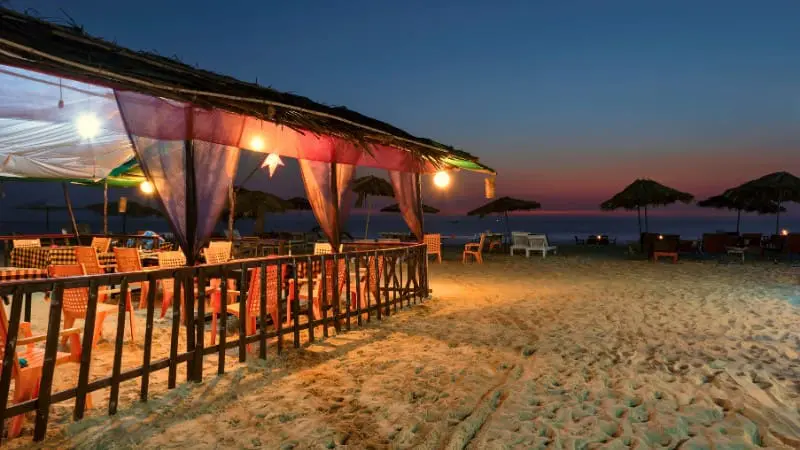 Beachfront dining at Calangute Beach, featuring local Goan cuisine and relaxed seating.