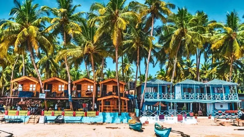 Colorful beach shacks at Calangute Beach, offering food, drinks, and sunbeds.
