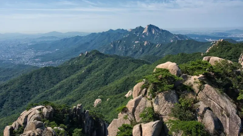 Hike Bukhansan National Park with stunning views near Seoul.