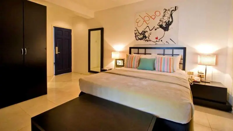 Stylish bedroom at Hotel Normandie Limited for luxury stay.