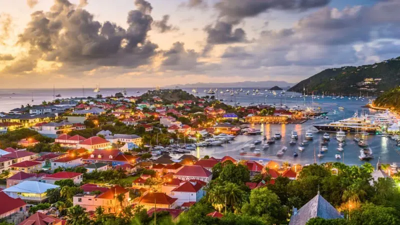Experience a stunning sunset view over Gustavia Harbor in St. Barts.