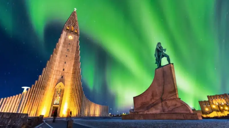 Reykjavik’s Hallgrimskirkja under the Northern Lights is a must-see in October.
