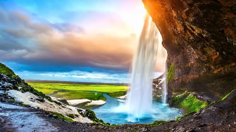 Seljalandsfoss waterfall illuminated by the soft autumn light.