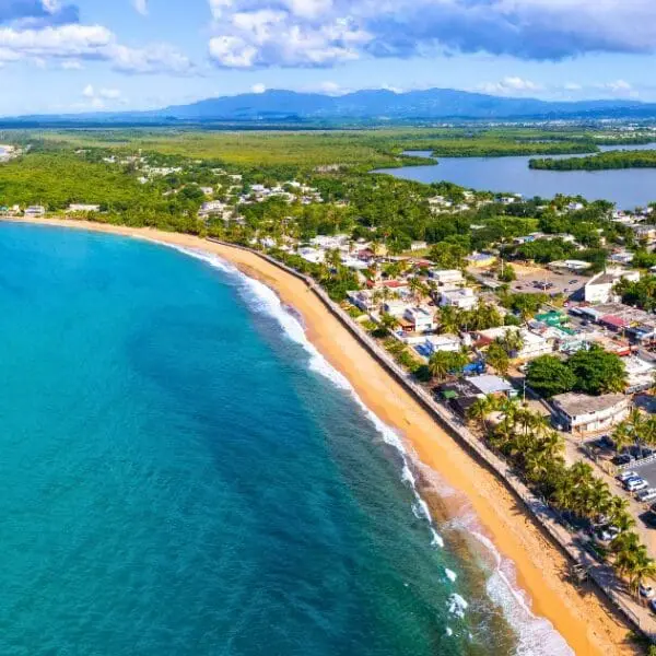 Aerial view of a beach, a beautiful spot in any Puerto Rico itinerary for 2024.