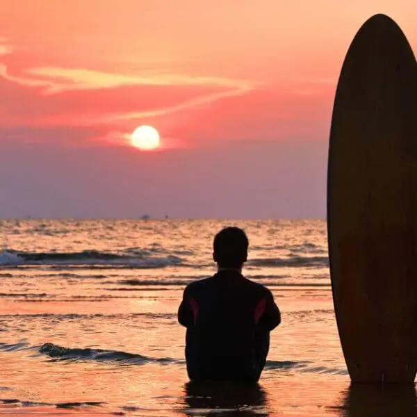 Watching the sunset after a day of surfing in Thailand is the perfect way to unwind.