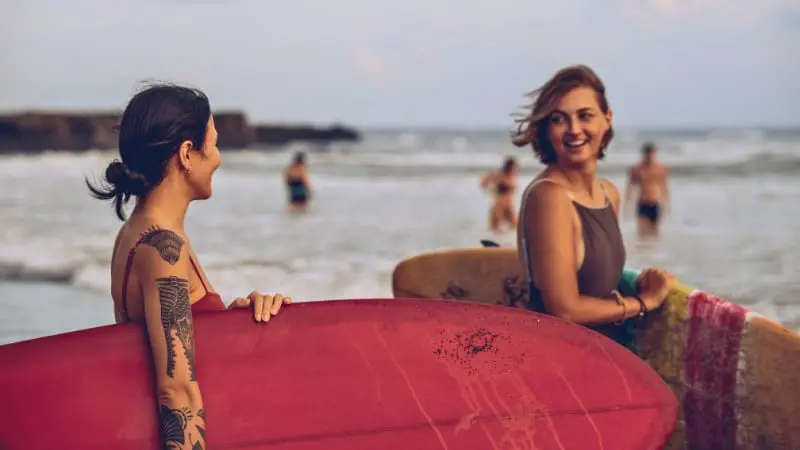 Surfers in Thailand enjoying the local surf culture and warm waters.