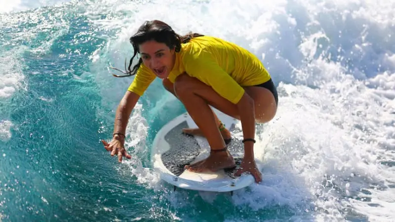 Stay low and balanced, especially during Thailand’s surf season for better control.