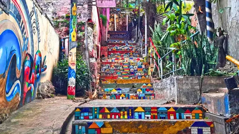 Colorful stairs in Loma San Jerónimo, Asuncion, known for murals and artisan shops.