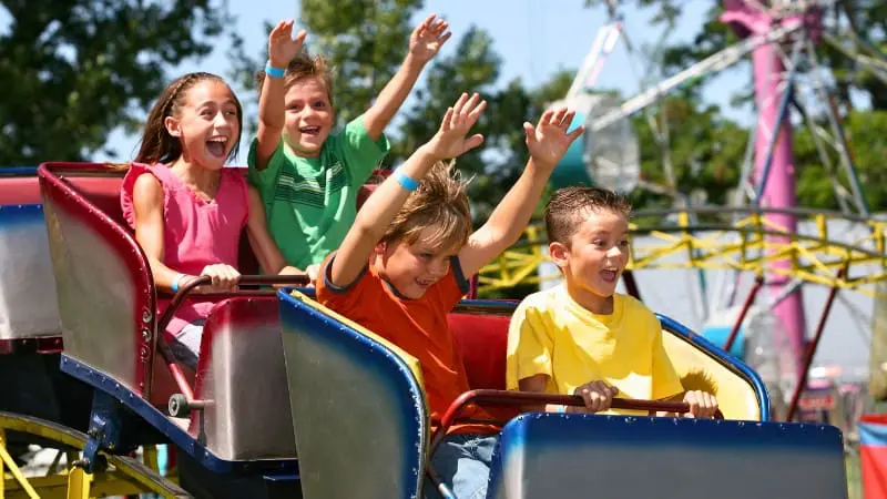Kids having a blast on roller coasters at the CNE Fair in Toronto.