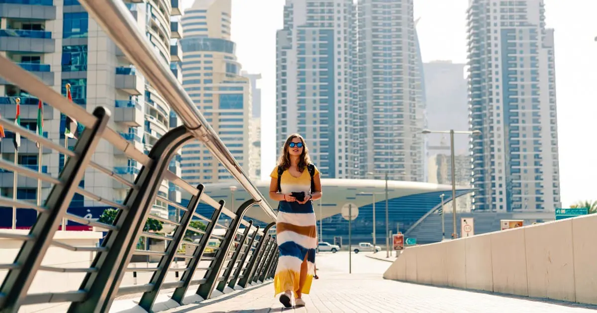 Woman in Dubai, following dress code rules at popular attractions.