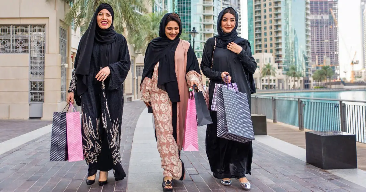 Dubai rules for female tourists, women shopping while dressed modestly.