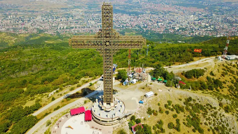 Aerial view of Millennium Cross with visitor area and nearby landscape.