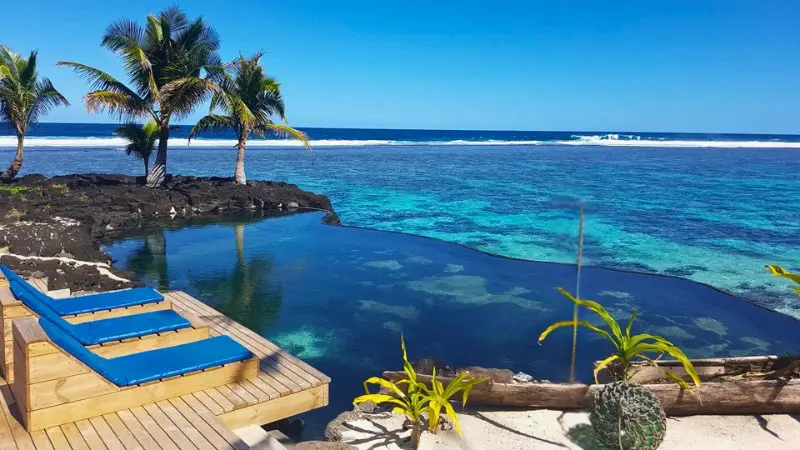 Salamumu Beach offers black sand and good surfing on Upolu.