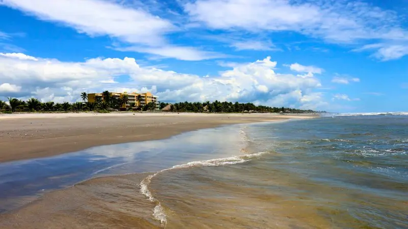 Costa del Sol Beach features soft sand and calm waves.