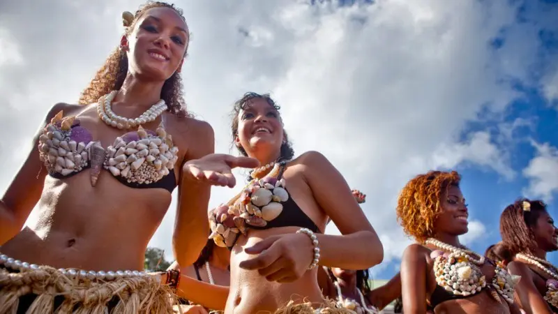 Locals performing in traditional attire during a cultural celebration in Seychelles.