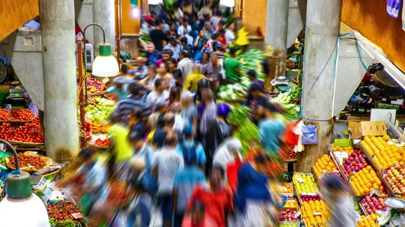 Crowded Central Market in Port Louis filled with fresh produce and locals.