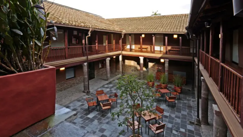 Quiet courtyard in a colonial building, perfect for a break during your Quito visit.