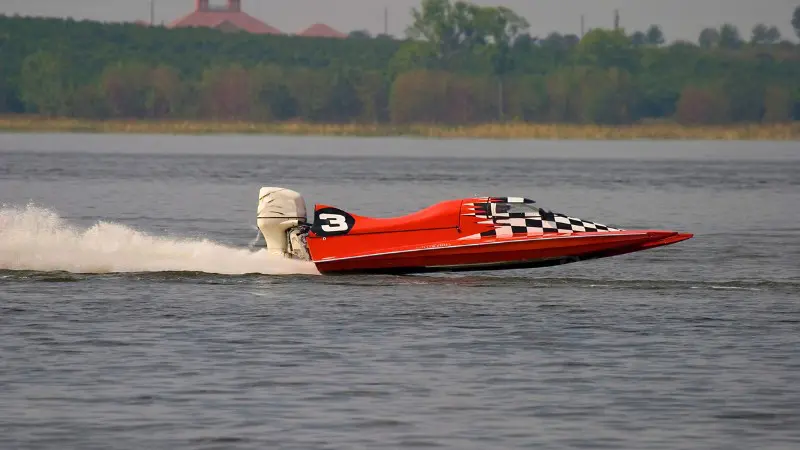 Speedboat racing in Tivat Bay, a thrilling water sport for visitors.