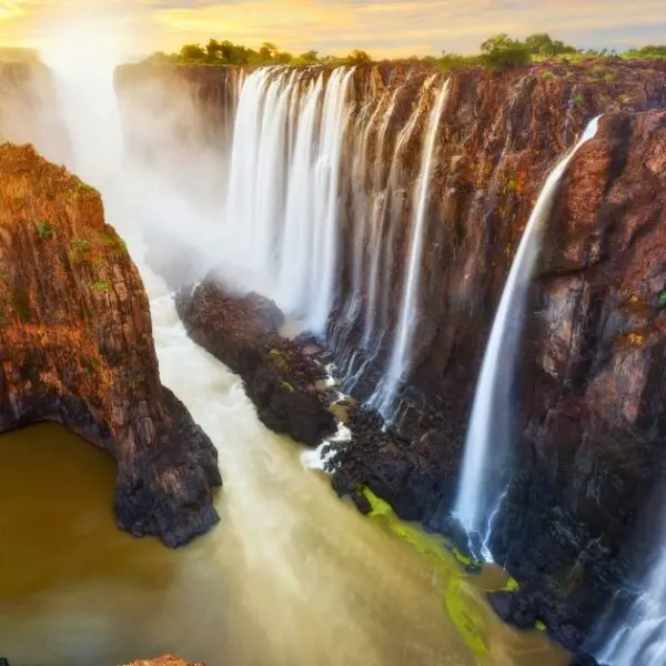 Sunset view of the falls, marking a perfect ending to your Victoria Falls travel guide.